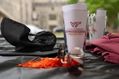 Graduation mortarboard and computer science glass